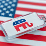 Republican elephant keychain on American flag background