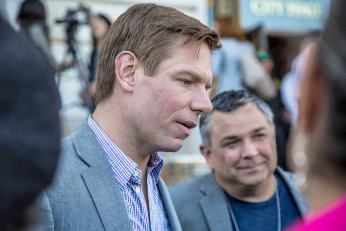 Two men engaged in conversation at a public event