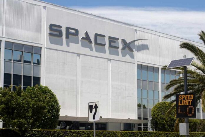 shutterstock_2206864931.jpg Exterior view of the SpaceX headquarters building with a speed limit sign