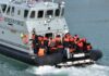 Border Force boat with migrants wearing life jackets