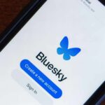 Bluesky’s Leadership Shake-Up: Stability at Risk? Mobile phone displaying the Bluesky app login screen