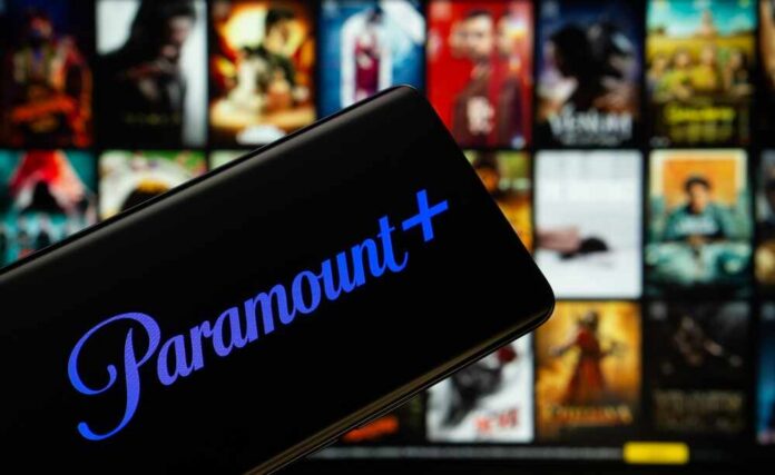 Mobile device displaying the Paramount Plus logo with a movie selection in the background