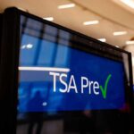Sign displaying TSA PreCheck information at an airport