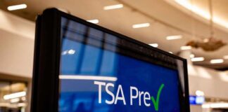 Sign displaying TSA PreCheck information at an airport