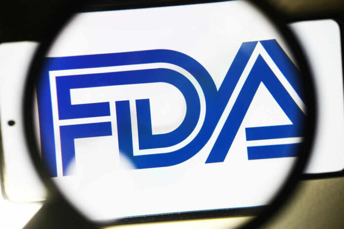 FDA logo under a magnifying glass.
