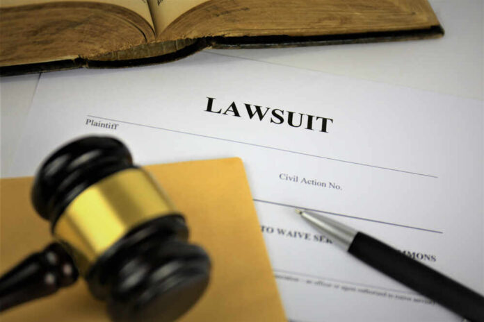 A gavel resting on legal documents related to a lawsuit