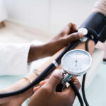 A healthcare professional measuring a patient's blood pressure