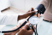 A healthcare professional measuring a patient's blood pressure
