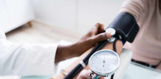 A healthcare professional measuring a patient's blood pressure