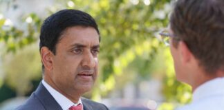 Two professionals engaged in conversation outdoors