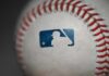 Close-up of a baseball featuring the MLB logo