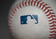 Close-up of a baseball featuring the MLB logo