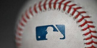 Close-up of a baseball featuring the MLB logo