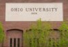 Sign of Ohio University displayed on a brick building
