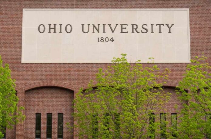 Sign of Ohio University displayed on a brick building