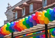 A vibrant display of colorful balloons arranged in a festive arch