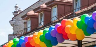 A vibrant display of colorful balloons arranged in a festive arch