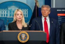 Government officials at a press conference in front of the White House