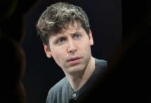 A man with a thoughtful expression during a conference