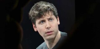 A man with a thoughtful expression during a conference