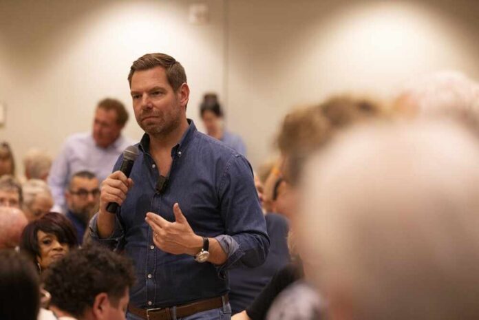 A speaker addressing an audience at a community event