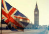 Union Jack flag waving in front of Big Ben in London