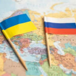 Russia-Ukraine Ceasefire—A Temporary Relief? Ukraine and Russia flags on a map.