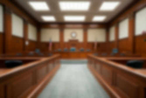 Empty blurred courtroom with wooden interior usa flags