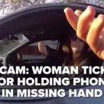Bodycam: Woman cited for holding phone in hand she is missing