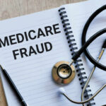 Notebook stethoscope and pen with Medicare Fraud text