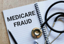 Notebook stethoscope and pen with Medicare Fraud text