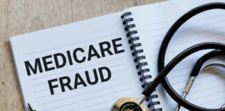 Notebook stethoscope and pen with Medicare Fraud text