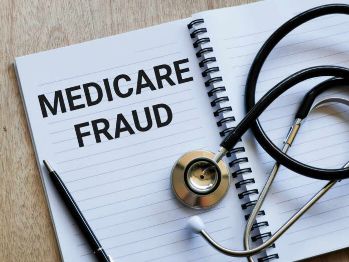 Notebook stethoscope and pen with Medicare Fraud text