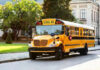 Yellow school bus parked on suburban street