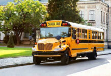 Yellow school bus parked on suburban street