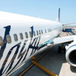 Close-up view of an Alaska Airlines airplane at the airport