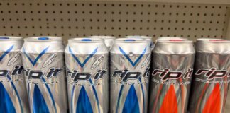 Cans of Rip It energy drinks displayed on a supermarket shelf