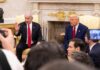 Two political leaders engaged in discussion in a formal setting