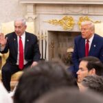 Rebellion Brewing: MAGA’s Israel Divide Grows Two political leaders engaged in discussion in a formal setting