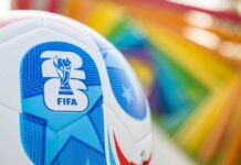 Close-up of a FIFA World Cup soccer ball with a colorful background