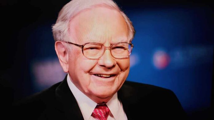 Smiling man in a suit with glasses against a blue background