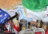 An illustration featuring oil barrels, an oil pump, and flags of the USA and Iran over a map of the Middle East