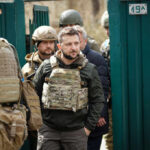 Ukraine’s Patriot Missile Push—Will America Relent? Man wearing tactical gear with military personnel around