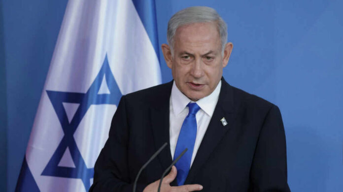 Israeli-Prime-Minister-Benjamin-Netanyahu_2458279225 Man speaking in front of Israeli flag backdrop