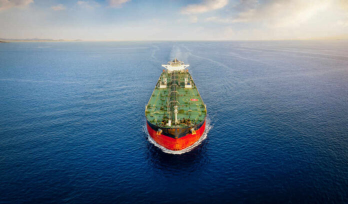 Oil tanker sailing straight through calm open sea