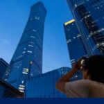 Plane slams into Beijing's tallest building, sends debris raining down onto streets