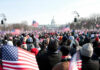 Crowd with flags in front of US Capitol building