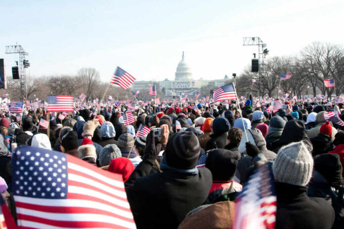 people-marching-towards-the-us-capitol-building23632015jpg Crowd with flags in front of US Capitol building