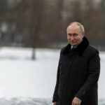 Crimea Fuel Crisis Exposes Putin’s Weakness Person in dark coat standing on snowcovered ground