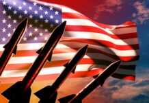 Silhouette of missiles in front of an American flag